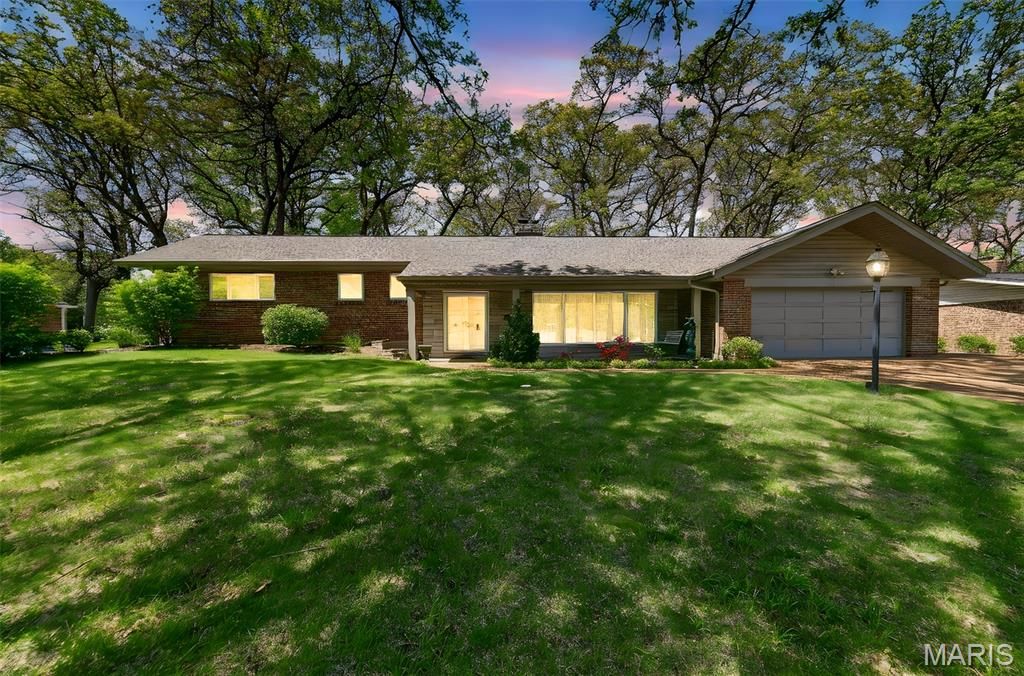 Photo of 8827 Rock Forest Drive, Grantwood Village, MO 63123 (MLS # 26024221)