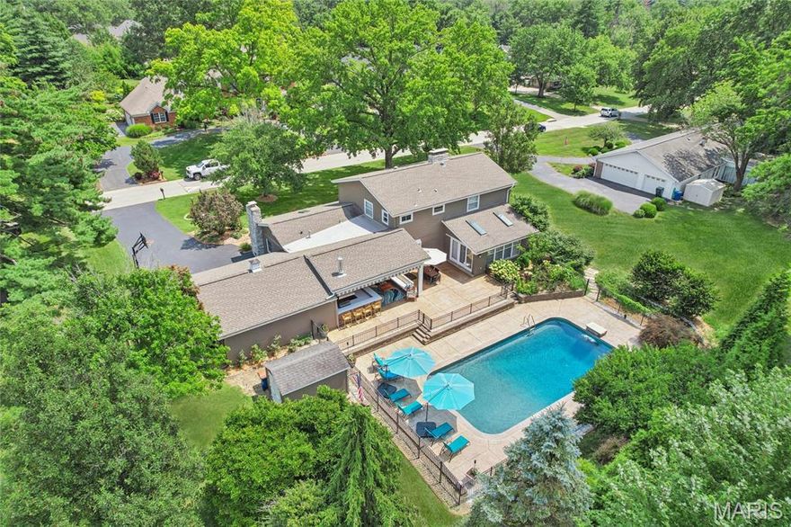 OPEN HOUSE ON 9/14 CANCELLED. Luxury Living Meets Everyday Comfort on a Private 1-Acre Retreat. Discover this stunning 2-story, 5-bedroom residence offering the perfect blend of elegance and functionality, ideally situated in a prime and convenient location. From the moment you step inside, you're greeted by a soaring vaulted great room featuring a gas fireplace, skylights, and three walls of expansive windows that bathe the space in natural light. Adjacent to the great room, a sophisticated home office with its own fireplace creates an ideal setting for remote work or quiet reflection. The main-level primary suite is a true sanctuary—boasting a spacious sitting area, a cozy fireplace, and a luxurious ensuite bathroom. Upstairs, you’ll find a second primary bedroom with an updated private bath, along with three additional generously sized bedrooms and a well-appointed guest bathroom. The outdoor living space truly shines. A covered patio with retractable awnings, enclosures, and a heater creates a comfortable three-season haven for entertaining or unwinding. The equipped outdoor kitchen—featuring a premium grill, vent hood, and bar area makes hosting a breeze. At the heart of the backyard oasis is a heated saltwater pool—10 feet deep and perfect for both relaxing swims and summer fun. Set against the backdrop of a beautifully landscaped and private 1-acre lot inclusive of invisible fence for pets. 3,152 of finished space and 1,027sqft unfinished basement.