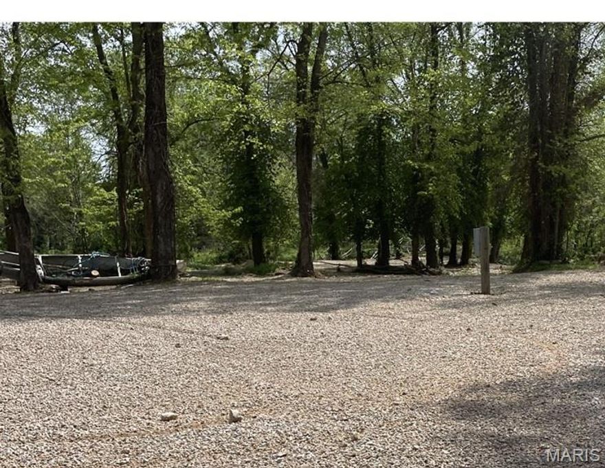 If you are looking for a majestic place to park your camper and enjoy fun in the sun on Current River, this is it! Located inside a gated RV Park inside of Van Buren you will find this .70 +/- acre lot.  City water and sewer are onsite and the lot has two 50 amp RV hookups for campers along with some trees to provide shade from the blazing summer sun.  You can enjoy the amenities of the RV Park by using the private boat ramp or laying or sitting alongside the Current River.  There is nothing better than splashing in the crystal clear water on a hot summer day. The lot is located inside of city limits with local amenities for dining and shopping or enjoying a frozen custard.  All lots are privately owned and the park has property owner restrictions for your protection and camping experiences. Don't drag your camper back and forth when you can own your own piece of property for family enjoyment year after year. Additional Rooms: In Platted Subdv.