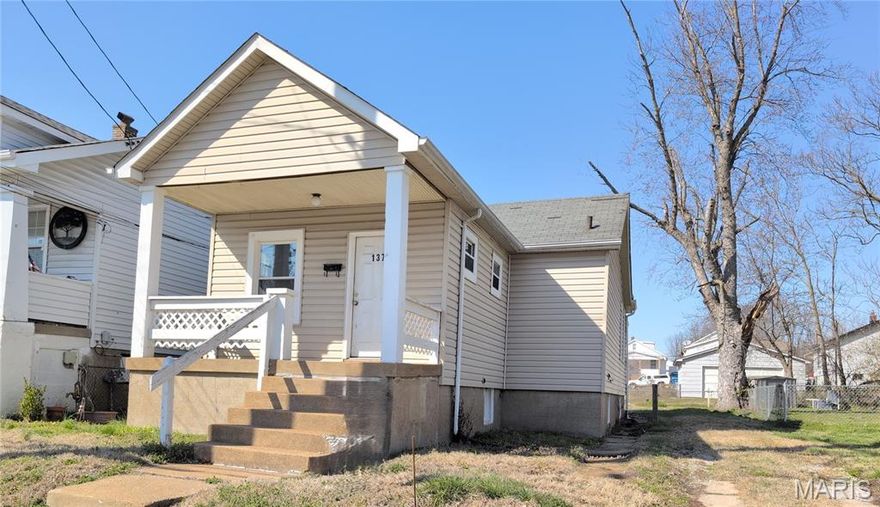 Charming Hancock Place bungalow — don’t miss this value-priced opportunity! This home offers 2 bedrooms, 1 bath, some original wood flooring, eat in kitchen. Separate Dining room. Covered front and back porches. Parking pad/patio off the alley in a partially fenced yard. Full walk out basement with lots of storage and possibilities. Property sold AS-IS. Seller makes no representations or warranties and will not perform repairs or provide inspections. Previously used as rental property.