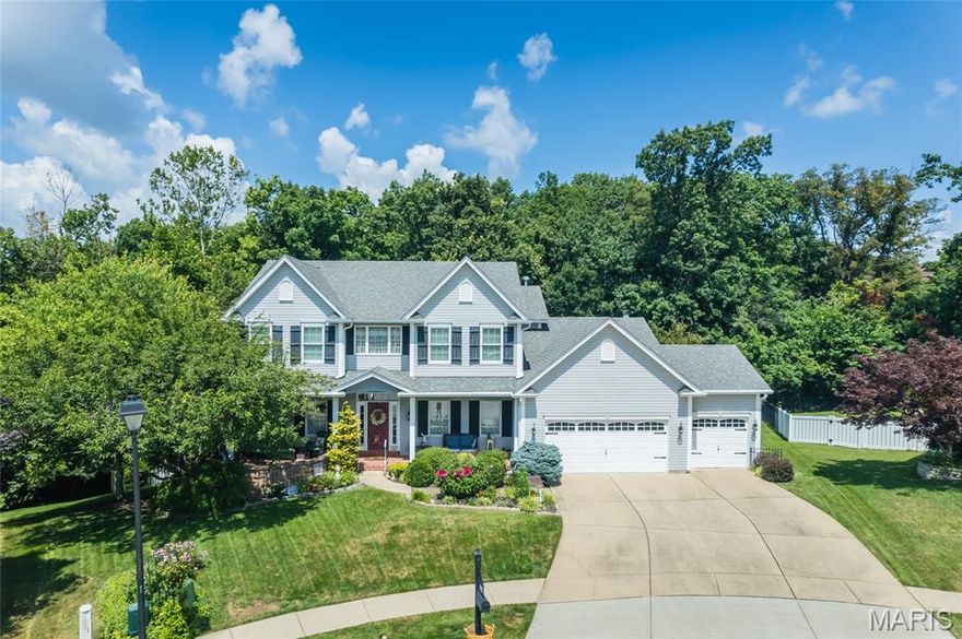 This Sprawling Two-Story Home, Freshly Painted on Both Levels '26, With Over 3,300 Sq Feet Of Living Space Is A Must See! Featuring A One-Acre Heavily Wooded Back Drop and NEW HVAC 3 Years Ago. Main Level Provides an Incredible amount of Space To Relax Or Entertain With Living Room, Family Room, Kitchen - Hearth Room Combo (Incredible Cabinet & Counter Space, Center Island, Desk Hub, Wood-Burning Fireplace, And More), Dining Room, & 1/2 Bath, Main Floor Laundry And Bonus Enclosed Sun Room With Wooded Views. Heather Glen Boasts Hardwood Flooring, Crown Molding, Wainscoting, And Other Architectural Features Throughout The Home. Upper Level Primary Bedroom Suite With Full Bath (Separate Tub & Shower), 3 Additional Large Bedrooms And Second Full Bath!  Walkout Lower Level Provides Bonus Room And Endless Opportunities To Meet Your Future Needs. Patio Oasis Overlooking Your Private, Wooded Lot Allows You To View From Your Spa While Relaxing Or Exercising. Cozy Extended Front Porch Area. . Spacious. 3 Car Garage. Cul-De-Sac Lot!