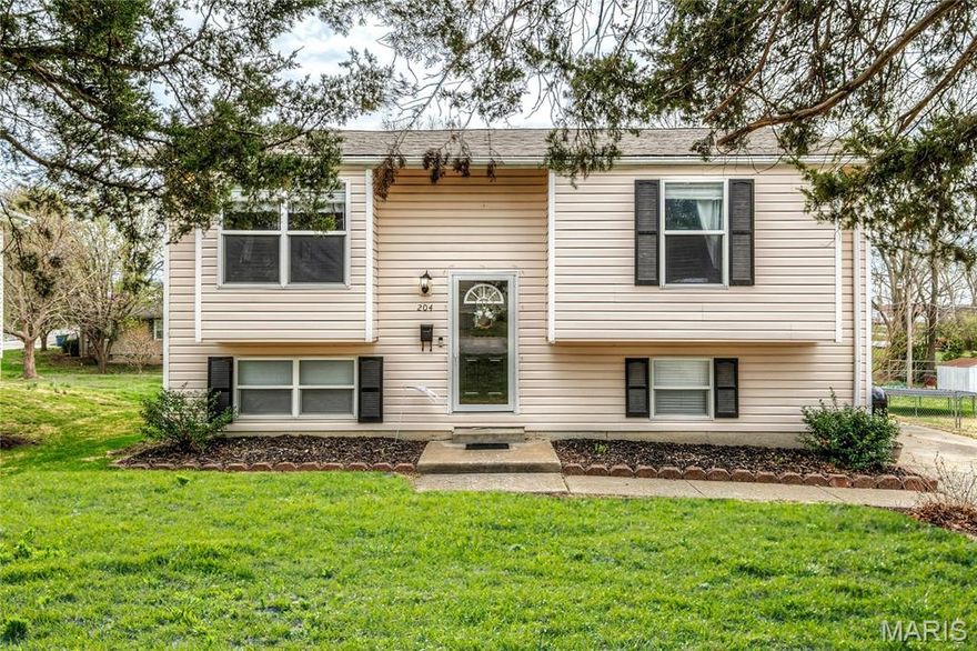 UPDATED split foyer cottage with 4 bedrooms, 2 baths, FINISHED LOWER LEVEL and FENCED BACKYARD - walking distance to shops and restaurants along Main St and Pearce Blvd. Curb appeal includes low-maintenance vinyl siding, plus a double driveway for 4+ vehicles. Soaring 2-story entrance steps up to flexible great room with charming window seat. Eat-in kitchen with shaker cabinets in RICH WOOD finish, Milano GRANITE counters, stainless appliances with smooth-top stove, and water-resistant luxury vinyl plank flooring. Dining area sliding door to SCENIC DECK overlooking backyard and trees - ideal for entertaining. Updated baths with granite vanity tops, tub/shower combo on main level. White 6-panel interior doors and breezy ceiling fans throughout. Downstairs family room, GUEST QUARTERS (bedroom and bath with shower), bonus room, plus convenient laundry and storage. Almost QUARTER ACRE lot with rear shade trees and space to garden, relax and play. Just 6 minutes to 250-acre QUAIL RIDGE PARK with trails, playground, fishing lake, dog park and more! AWARD-WINNING SCHOOLS. Walkable location with errands within a mile.