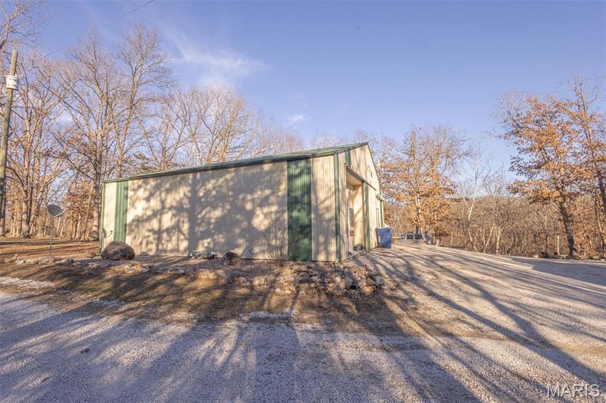 Look at this incredible setup in the Mark Twain Lake area, located approximately 6 miles from Spalding Beach and the boat ramp! This 2015, 4-bedroom, 1-bath home with a loft area sits on 2.8 park-like acres in the established Villa De Woods subdivision. The family room features reclaimed barn wood from an old barn, adding warmth and character to the space. The home offers FAE heat and central A/C, and a front sliding door that can fully close off the front of the home. The exterior is well-suited for entertaining, storage, and lake life, with ample room for campers, trailers, and guests on a large, graveled area at the end of a dead-end road.

Improvements include:
30 ’x 40’ outbuilding with electric and gravel floor
18’ x 22’ x 9’ carport pavilion with electric
8’ x 48’ storage container with electric
18’ x 30’ three-sided carport with electric
18’ x 32’ x 12’ carport with concrete slab covering a camper that conveys
Multiple RV hookups

Additional features include a fire pit, a designated area for an above-ground pool, a wet-weather stream, and so much more.  Simply too much to list — come take a look!