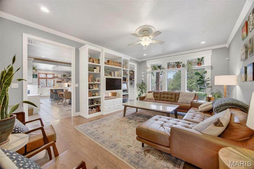1550 Cedar Lawn is more than a home — it’s a statement of design and quality craftsmanship, offering 4,600 square feet across three beautifully finished levels. Situated on a large corner lot, the residence features 6 spacious bedrooms plus an office, 3 full baths & 2 half baths. The two-story entry foyer leads to a sun-filled living room with lovely hardwoods, built-ins, and floor-to-ceiling windows. At the heart of the home is a stunning kitchen and hearth room with many recent updates including a Quartz island with seating, gorgeous tile work, floating shelving, freshly painted cabinetry, new stainless-steel appliances, double pantry, and a gas fireplace. The main level primary suite offers a serene retreat with a luxurious soaking tub, double vanity, and massive walk-in closet. A home office and powder room complete the main level space. Secondary suites continue to elevate the home on the upper level, offering four spacious guest bedrooms and two full baths. Thoughtful design extends throughout the home — from custom built-ins to multiple areas for relaxation and entertaining. The basement offers nearly 1,000 square feet of finished space, a half bath, storm shelter, and multiple storage spaces in the unfinished section. Outdoor living includes a covered patio, a backyard fully fenced with invisible fencing, a brand new 15’ swim spa/hot tub (52” deep), and well-established landscaping. All of this sets in one of Lebanon’s most desirable Northside neighborhoods, just on the edge of town. Act now, because you don’t see quality custom-built homes like this hit the market often. Video tour link is available!