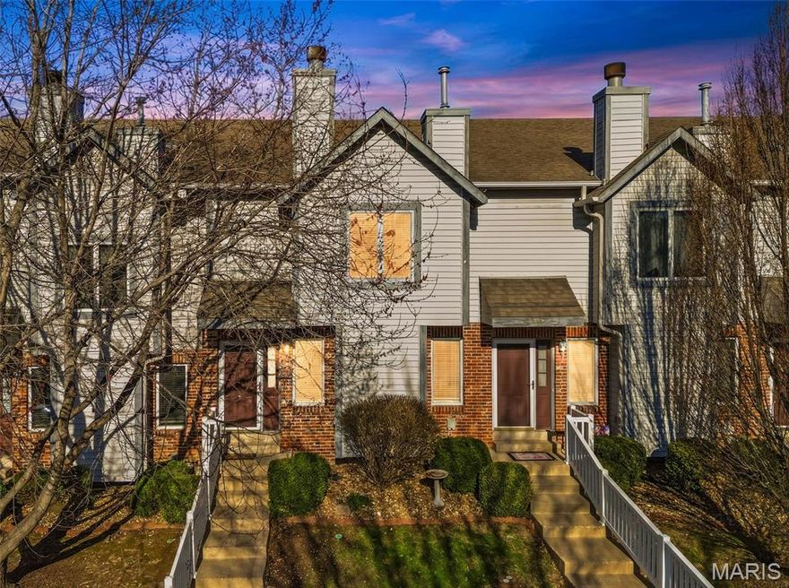 Welcome to this beautifully maintained townhome featuring two primary suites & an attached 2-car garage. The main level showcases luxury vinyl plank flooring throughout, a cozy wood burning fireplace, along with a convenient powder room and coat closet. The kitchen is thoughtfully designed w/ abundant cabinetry and countertop space, backsplash, pantry, and a versatile coffee bar or workstation. The adjoining dining area opens through sliding doors to a composite, maintenance-free deck—ideal for relaxing or entertaining. Upstairs, the primary suite features a charming window seat with built-in storage, two walk-in closets, and a  bath with a stand-alone shower, single vanity with makeup space, and linen closet. The second suite also offers a walk-in closet and full private bath, providing comfort and privacy for guests or family. The lower level includes a dedicated laundry area with ample storage space. Enjoy the ease of maintenance-free living with a monthly fee that covers lawn care, landscaping, deck maintenance, roof, siding, snow removal, trash, and select insurance. Community amenities include a pool, clubhouse, and tennis courts. Ideally located near major highways with convenient access to shopping, dining, parks, and the Katy Trail.  You don't want to miss out on this one!