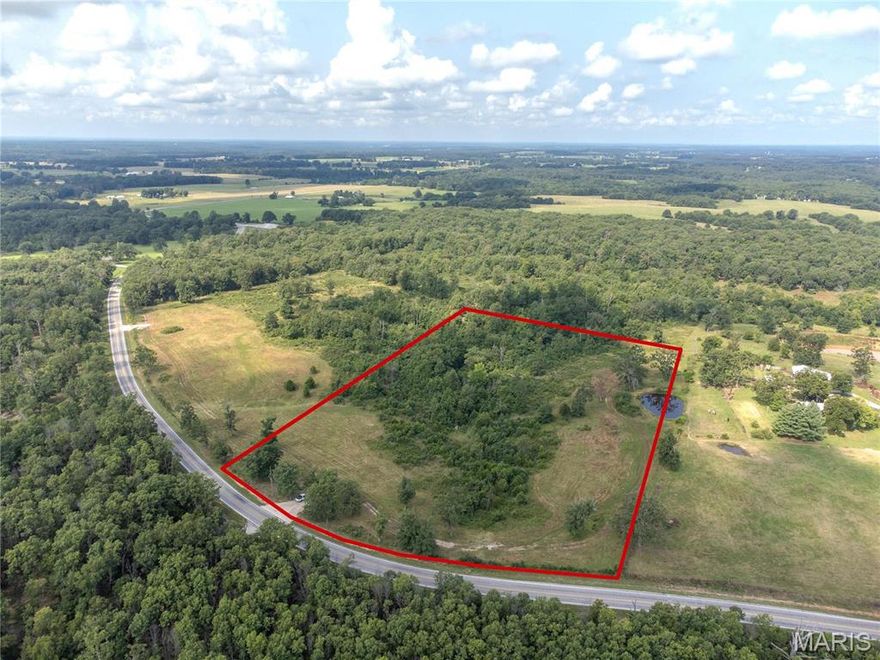Great location, off of a paved State Highway, this 10.99 acres of rolling land is ready to let your vision come to life. This land has no restrictions so you can build your new home, move a mobile on the land or just keep it to hunt on. Nice new drive way and gates installed. When you're not enjoying this great piece of land you're not even a 20 minute drive to Bennett Springs. This property has a recent Survey of 10.99 acres. Taxes are approximate also - new parcel number to come as well. Electric pole recently set as well, also has a shared pond.