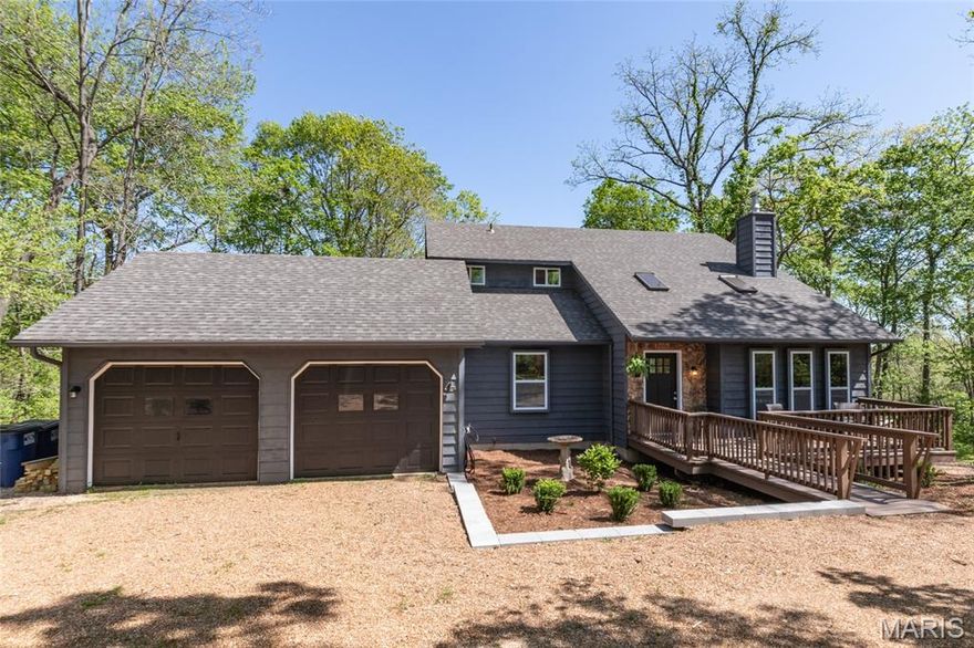 IF YOU ARE LOOKING FOR PRIVACY, SERENITY, QUIETNESS AND BEAUTY, LET THIS BEAUTIFUL PARADISE SETTING,  ON 3.1 ACRES BE YOUR NEW HOME. THIS MUST SEE 3 BR, 2 FULL BA'S BEAUTIFUL HOUSE, HAS BEEN TOTALLY UPDATED. THE MAIN FLOOR LAUNDRY ROOM IS NEXT TO THE KITCHEN. IT HAS A NEW A ARCHITECTURAL ROOF.  IT FEATURES NEW EXTERIOR AND INTERIOR PAINT THROUGHOUT. IT HAS NEW LUXURY VINYL PLANK FLOORING THROUGHOUT. ALL EXTERIOR WALLS HAVE BEEN BUILT WITH 2" X  6" CONSTRUCTION.  MOST WINDOWS HAVE BEEN UPDATED. THE BASEMENT HAS ROUGHED IN PLUMBING FOR A 3RD BATH. IT HAS AN OVERSIZED 2 CAR GARAGE. IT ALSO HAS A UPDATED 200 AMP ELECTRIC PANEL AS WELL AS TWO SUB PANELS. IT HAS ALL NEW GFI'S, OUTLETS AND SWITCHES. ALL ROOMS HAVE NEW CEILING FANS AND LIGHTS. ALL DECKS HAVE BEEN COMPLETELY UPDATED WITH  EXTREMELY STURDY RAILING. ALL KITCHEN CABINETS ARE NEW WITH QUARTZ COUNTERTOPS AND MODERN SOFT CLOSE DOORS.  ALL TOILETS, SINKS & VANITIES WITH NEW QUARTZ COUNTERTOPS IN BOTH BATHROOMS ARE NEW. THIS HOME IS MOVE IN READY.  THE DECKS ARE EXCELLENT FOR ENTERTAINING & SUMMER BARBECUES & THE VIEW IS EXCELLENT WITH ABUNDANT WILD LIFE TO OBSERVE. THE KITCHEN HAS NEW STAINLESS STEEL APPLIANCES, A NEW MICROWAVE, NEW STOVE AND A NEW DISHWASHER. ONE OF THE GREATEST AMENITIES IS THE 843 ACRE DON ROBINSON STATE PARK THAT IS WITHIN WALKING DISTANCE AND IS ACROSS THE STREET FROM THE SUBDIVISION. THIS HOME WOULD MAKE A GREAT GET AWAY OR A SECOND HOME. THERE WILL BE AN OPEN HOUSE SATURDAY AND SUNDAY, MAY 23rd AND 24th, FROM 12-4PM. Open to the public.