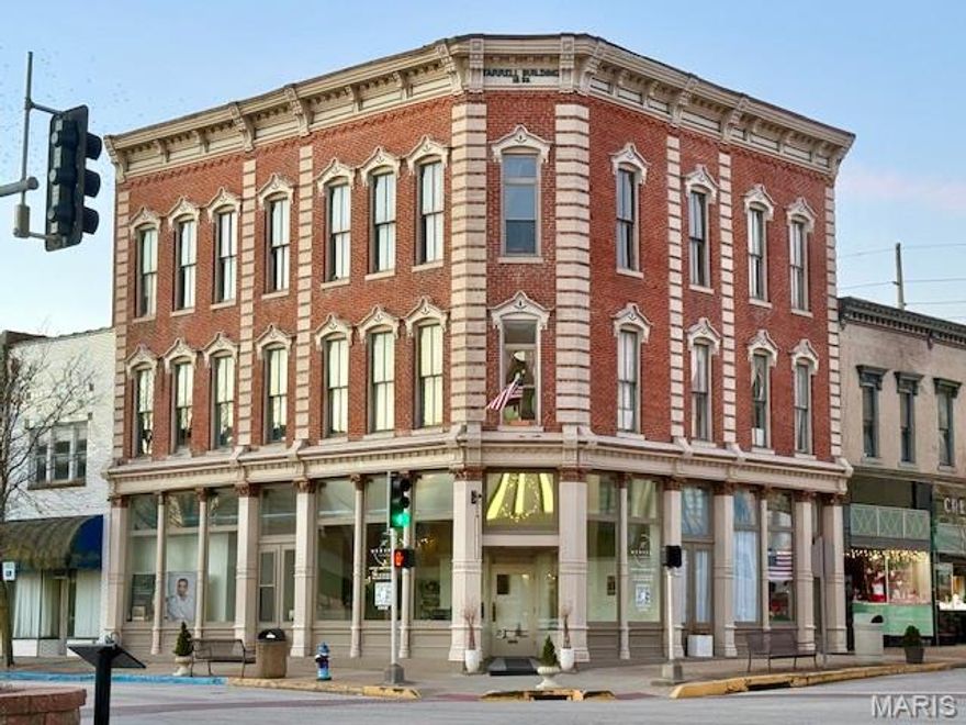 This grand building sits at the corner of Broadway and Main Street in Hannibal acting as the cornerstone of the downtown business area. This historic building has a fantastic view of the Mississippi River, the light house that was built as a memorial to the famous Mark Twain, and Main Street where people from all over come to enjoy The Folk life Festival, Steam Punk and The National Tom Sawyer Days. Not to mention perfect seating for the parades and the 4th of July fireworks! The 1st floor houses a med spa currently. This space has a kitchen, bath and sleeping area so there is the potential to live where you work. The stylish interior would be suitable to most any small business. With the visibility from all the street level windows on Broadway and Main Street, your business will be very noticeable.  The 2nd floor has a long-term lease in place. It features a 1 bedroom, 1 bath apartment with a large open concept living room, dining room, and kitchen area. Great views too! For added income, there is also an efficiency apartment that is very similar to a hotel room. Full bath, seating area, and bedroom. Access to the common area laundry as well. On the 3rd floor you will find where the current owners have resided. They created a unique open floor concept space that features the best views of downtown (and the river), very tall ceilings with exposed beams, the most unexpected bathroom housed in a metal feed bin that is a must see, a wet room open shower, a full kitchen, large pantry and a coffee bar. Most things furnishing the 3rd floor are negotiable with the sale. There is also an elevator that accesses all floors. I can only imagine the stories this building could tell. Take the time to consider making this your home with penthouse living on the Mighty Mississippi or maybe use it for investment purposes. Either way, it deserves a new owner that will love it as much as the current one.