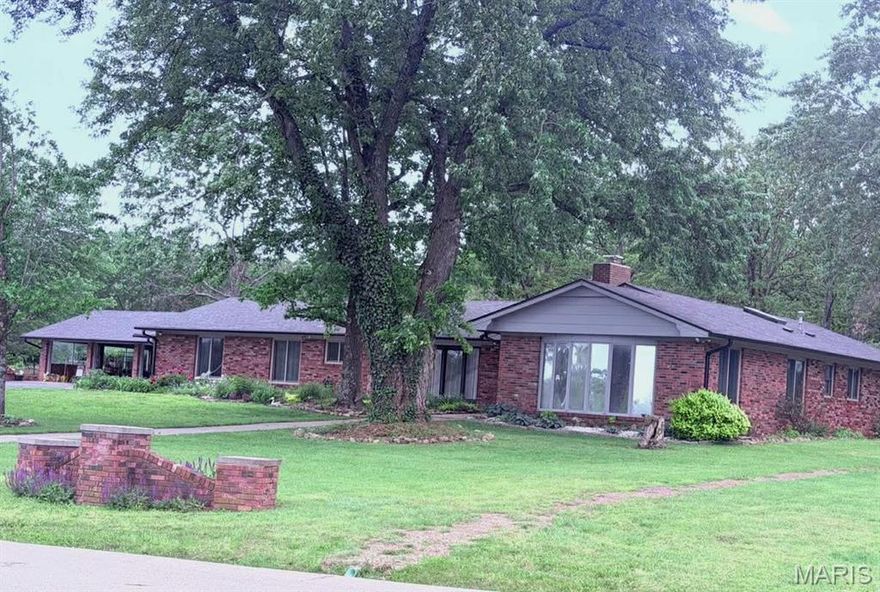 The Home  YOU have been waiting for!    All Brick,  over 4000 square feet,  with 5 bedrooms, and 3 bathrooms.   Several Living Room areas.  with a great updated kitchen,  with custom cabinets, and grantite Counter tops,   Great appliances,  Refrigerator, stove, dishwasher, two microwaves and a trash compactor. Anderson Windows.  Two skylights!  There is a very large Rec Room,  and four bays in the garage.  Motion lights and a security  system provide for safety and security. Internet is hooked up to Starlink. The Roof and the hot water heater are less than a year old, roof has new gutter guards..   Split bedrooms,  with two on one side of the house and three on the other.  Perfect for large families, or  even an inlaw section.   Any size family would love all of the space and closets and storage found inside this large home.   The two fireplaces are wood burning.  One has an electric insert for instant heat.  There are three separate furnaces, and three separate Air units.  Zone heat and air provides savings on heat and air bills.  A new sliding door takes you out to a large Courtyard , at the back of the house,  the lot is over two acres,  covered with large trees and many flowers, and a storage shed.  The driveways have been recently sealed.  The view out front is so peaceful,  you will spend many hours just looking at the water, or watching the geese,  or going out to catch a fish or two.   This home has so much to offer,  don't delay schedule a showing today.