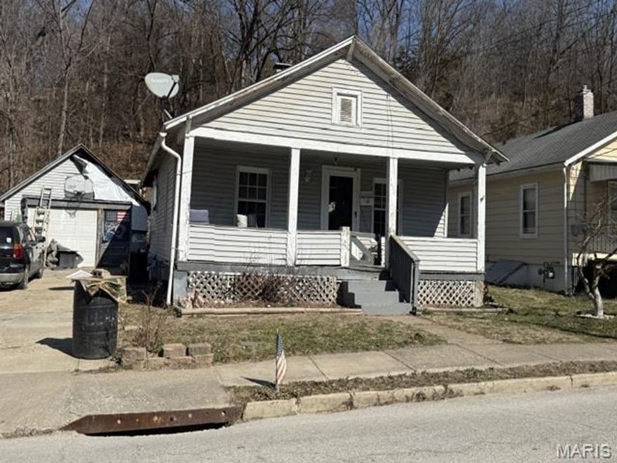 Relax and enjoy the day on the covered front porch of this cozy bungalow featuring a spacious approximately 874 square feet, 1 bedroom, 1 bath, and detached garage. Auction Occupied – NO ACCESS OR VIEWINGS of this property. Please DO NOT DISTURB the occupant. "As is" cash only sale with no contingencies or inspections. Buyer will be responsible for obtaining possession of the property upon closing.