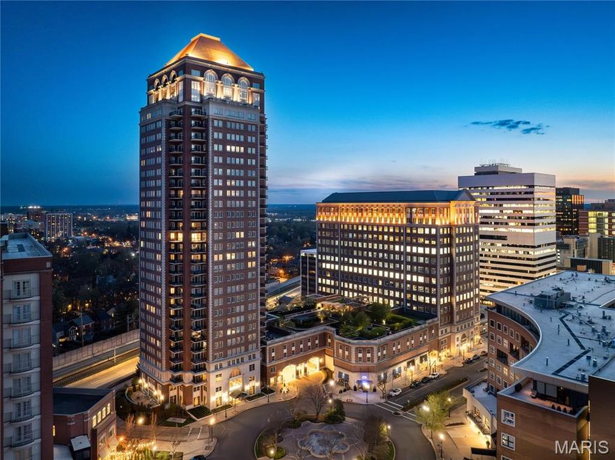 This 2,800 SF Condominium offers a lifestyle of luxury and convenience in Clayton's premiere high rise, The Plaza.  Magnificent views of the fountain of Carondelet Plaza, with an open floor plan featuring wood floors, dual terraces, and enormous half circle picture window, an architectural detail singular in the entire building. The Primary Suite is an expansive retreat with sitting room, organized room size closet, and luxe bath featuring double vanities and separate shower and tub. The 2nd bedroom is en-suite. The eat-in kitchen features granite counters, double ovens, electric cooktop with hood, abundant cabinetry, breakfast room, and a private terrace. The laundry room has abundant space. Additional storage space completes the unit. Building amenities include pool, dog park, fitness center with massage room, above street level  garden with grilling stations, party room and conference center, 24 hour doorman and concierge, valet parking, and on site management. Every type of dining experience is available within just steps of The Plaza's front entry; from breakfast and coffee shops, to fast casual lunches, and world class Fine Dining Steak and Seafood restaurants. Two parking spaces in the secured garage, and storage locker included.