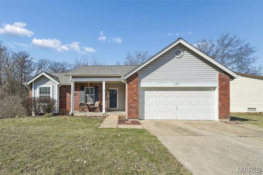 Welcome home to this inviting ranch in a quiet St. Charles neighborhood, offering bright living spaces, a finished lower level, and a fantastic outdoor setup. The vaulted great room features a cozy wood burning fireplace, luxury vinyl plank flooring, and a ceiling fan for year round comfort. The eat in kitchen includes a pantry and opens to the two level deck—perfect for morning coffee, grilling, or relaxing with a wooded backdrop. Three main floor bedrooms each include ceiling fans, with the spacious primary suite offering a private full bath. The finished lower level expands your living space with a large rec room, bar area, bonus room, full bath, and generous storage. A fenced yard, attached two car garage with workshop space, and Francis Howell North schools complete the package. Convenient to parks, shopping, and major highways, this home blends comfort, space, and everyday convenience.