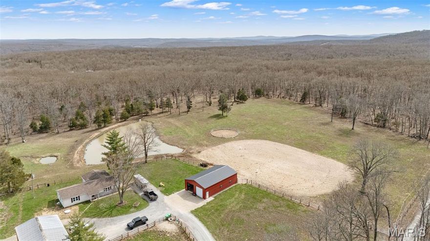 Private 19 acre m/l country retreat featuring a 4 bedroom 2 bath home with stunning rural views. Ideal for horse lovers, this property includes a brand new 6 stall classic equine barn and riding arena. A small pond adds to the natural beauty, while a large outbuilding provides excellent storage for equipment and supplies. This property is perfectly suited for hobby farmers (chicken coop included in sale), horse enthusiasts, or anyone seeking space and serenity.