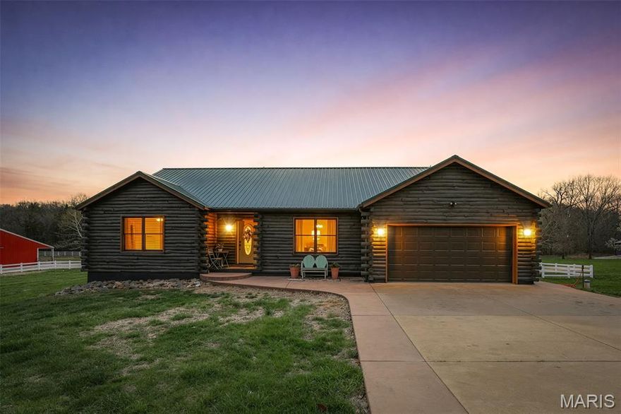 Load up the Horses and live the Lodge Life!!!  a total of 3 Parcels +/- 14.36 Acres. This breathtaking view of Pastures lined with Vinyl Fencing, take in the view of abundance of Wildlife, and take time to smell the wildflowers. Your own Private pond to Enjoy while you sit on your back Screened Porch having your Morning Coffee.  This Log Cabin Features an open floor plan, walk into your impressive towering Stone wood burning Fireplace.  The Kitchen has Granite Counter Tops.  Chief like stove with an oversized walk in Pantry, An Island for all your entertaining with ample Storage and Natural light to enjoy the endless Views. Main Floor Laundry. Full Laundry hook up in lower Level as well. The Primary Suite offers Double Vanity and Walkin Shower. Enjoy your walk in Closet. Tons of Natural Light and View of Pond and Pastures. Two other Bedrooms and Full Hall Bathroom. Lower level features a Living Aera with French Doors, Just Minutes to your barn. And a Work-out Gym space, Two oversized Office/ Rooms. Plenty of storage.  The Barn Features are Equipped with very impressive Stalls, Sliding Doors to the Pastures. The oversized barn  50x70 provides a tack room, hay storage, and concrete flooring through the entire Barn.  The covered porch /Patio is a great place to relax and have Lunch while watching the horses grace in the pasture!  You will fall in love with this pristine Property, the perfect location to call home and Welcome to the Country Living Lodge Life!