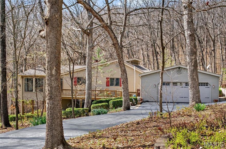 Amazing custom ranch home set on 3 private acres! This one-of-a-kind property features a unique layout and is loaded with updates and thoughtful details throughout. Wake up each morning to serene views through stunning architectural windows, offering natural light and a true connection to the outdoors. Enjoy the perfect balance of privacy and community, with space to unwind while still having neighbors nearby. Step out onto multiple decks to relax or entertain, all while taking in the peaceful surroundings. The updated kitchen offers convenience with main floor laundry. The spacious primary suite includes a large bath with separate shower, walk-in closets, and a private deck. The expansive finished walk-out lower level features two bedrooms with the potential for two additional bedrooms, plus a full bath, family room, cedar closet, hobby room, wet bar area, and an additional washer/dryer hookup—ideal for a mother-in-law suite or extended living. This is truly a must-see home!