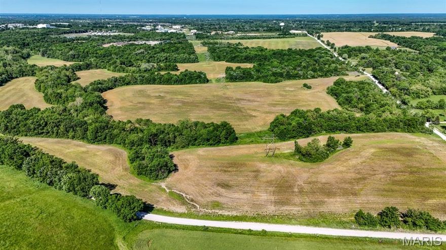 Prime 188.7± acre tract within Ewing Industrial Park, offering a rare combination of shovel-ready infrastructure, central U.S. access, and immediate income. Ideal for data centers, advanced manufacturing, logistics, solar or wind farms, recreational, or mixed-use development.

Key Features:
• Missouri Certified Site – Pre-qualified for industrial use with reduced development risk and faster permitting.
• Power Ready – Adjacent 13.8 kV electric service and onsite substation for high reliability and scalable capacity.
• Water & Sewer – 160 kGPD water capability with 1.5M-gallon tower; 200 kGPD wastewater capacity.
• Natural Gas – 4" Ameren Missouri gas main for industrial applications or backup generation.
• Telecom – High-speed fiber and multiple carrier options available.
• Location – 5 miles to I-70 via US 63; close to Columbia Regional Airport and COLT Railroad Transload facility.
• Central U.S. Advantage – Equidistant to St. Louis and Kansas City, with major Midwest markets within a day’s reach.
• Workforce – Near the University of Missouri for access to a highly educated labor pool.

Income & Development Potential:
• Approx. 120± acres currently farmed, producing $20,000 annual income.
• Zoned for light industrial, residential, or mixed-use development, offering multiple exit and development strategies.
• Natural wildlife habitat adds recreational or amenity value.

A rare large-acreage, utility-served site within city limits—ideal for investors, operators, and developers seeking a scalable, infrastructure-rich property in a high-growth market.