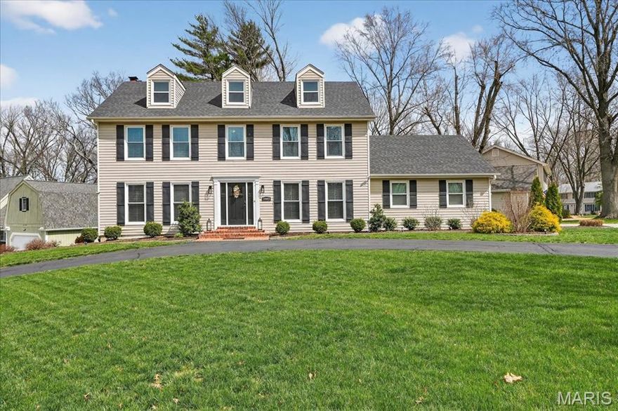 Expanded 2-sty Colonial with remarkable curb appeal. Located in a highly desirable Clarkson Woods neighborhood with award-winning Rockwood schools. Extensive updates and improvements during ownership include roof, windows, HVAC, hot water heater, hardwood flooring and maintenance free deck and much more. Classic center hall floor plan features oak hardwoods, detailed trim work & custom built-ins. Gracious entry foyer leads to formal living & dining rooms with crown molding & full-height windows, spacious family room with wet bar & brick fireplace flanked by built-in bookcases and private office with built-ins and spiral staircase leading  to Lower Level. Chef’s kitchen featuring glazed white cabinetry, granite countertops & 9’ center island opens to serine screened porch perfect for entertaining or relaxing with your morning coffee. Primary bedroom suite offers an appealing retreat with customized walk-in closet & luxury bath. 3 large additional bedrooms & hall full bath complete the 2nd floor living quarters. Lower Level entertainment space includes recreation room & game room plus office & full bath. Situated on an extensively landscaped cul-de-sac lot with composite deck, covered patio, circular drive & 2-car garage. Don’t miss this well loved and maintained home!