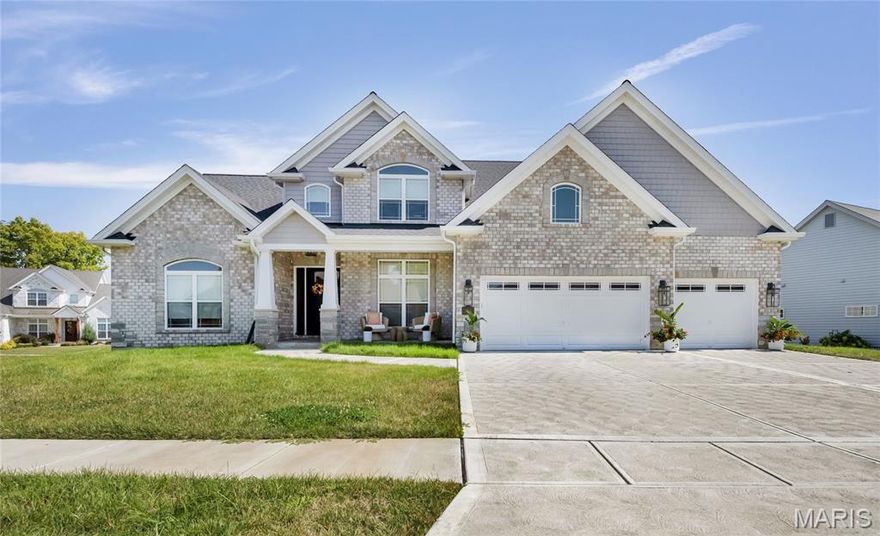 Luxury living in this quant and private subdivision of only 30 Executive Homes built convenient to downtown, Boeing, Amazon headquarters and STL airport. Soaring ceilings and stone fireplace surround just past the wood stairs w/wrought iron spindles will be the first thing to catch your eye as you walk in. This grand home built in 2023 by an esteemed custom home builder that only builds small select communities. Coffered ceiling dining room w/recessed lighting, 8’ doors throughout main level, along w/wide planked engineered wood flooring, crown molding and wall of transom windows on the back of home. All shades are remote controlled. Kitchen has all the bells w/large walk-in pantry, staggered white cabinets, quartz counters & on large island, pendant lighting, under-mount lighting, classy porcelain backsplash, 2-tone stainless appliances including 6-burner gas cooktop & vented hood. Beverage station has wine fridge and rinse sink. Mud room is large w/window and slop sink. Plenty of area to toss your coats & shoes w/bench and coat rack near 3-car garage entry also main coat closet near front foyer. Primary bedroom on main level has coffered ceiling, palladium window, gorgeous bath w/floor to ceiling tiled shower w/rain shower head, soaking tub, dbl vanities, natural stone flooring and 2 closets. Upper level sports a large bonus room and 3 bedrooms one with vaulted ceiling all with walk-in closets. 2 beds have private baths & 1 has a jack-n-jill bath. See-thru gas fireplace adjoins the backyard for chilling in the covered patio area or entertaining guest by watching the football game outside. Dual Zoned, Sprinkler system, 9'pour basement w/rough-in unfinished and ready for your plans.