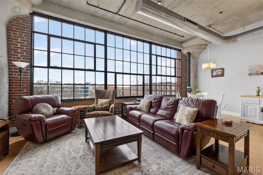 Sophisticated and filled with natural light, this stylish loft at West End Lofts offers the perfect blend of modern design and vibrant Central West End living. Expansive windows flood the open floor plan with natural light, highlighting wood floors and spacious living and dining areas designed for both everyday comfort and effortless entertaining. The designer kitchen features sleek Italian cabinetry, granite countertops with full backsplash, stainless steel appliances, a gas cooktop, and distinctive slate flooring. The spacious primary suite offers a spa-inspired bath with an oversized walk-in shower and separate six-foot soaking tub, creating a true retreat. A secondary bedroom and full bath provide flexibility for guests, a home office, or additional living space. Generous closet space and thoughtful finishes complete the interior. West End Lofts residents enjoy resort-style amenities including an outdoor pool, fitness center, billiards room, guest suite, and secure gated parking. Ideally located in the heart of the Central West End with easy access to restaurants, nightlife, the Cortex Innovation District, BJC Hospital, Washington University Medical School, Saint Louis University, and the trails and green space of Forest Park. (New AC 2023, washer/dryer 2025, dishwasher 2025)