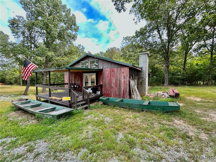Call to schedule your private showing today! This cabin is sitting on the side of Highway 63 just 5 minutes from the Heart of Houston. This property is currently being used as the Big Piney River Nature Center. If you are in need of a business location outside of the city limits, then this location is worth looking at. This rustic type cabin was built in 2023 and currently has a few more things to be completed. With a few more updates, this cabin could be an awesome Air BnB within 15 minutes of the Piney River. Do not hesitate to give us a call!!