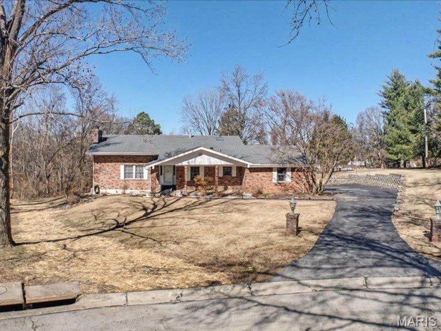 Welcome home to this spacious all-brick beauty, perfectly situated on a large, level lot of just over half an acre in a private cul-de-sac setting. Surrounded by mature trees and scenic views, this property offers the perfect blend of privacy, space, and opportunity.

Featuring 4 generously sized bedrooms and 3 full baths, this home is ready for its next owner to bring their vision and make it their own. The expansive primary suite offers a peaceful retreat, complete with a private balcony patio overlooking the lush backyard — the perfect spot for morning coffee or evening relaxation.

The main level showcases a dramatic sunken living room with a stunning floor-to-ceiling brick wood-burning fireplace, flanked by custom built-in bookcases — a warm and inviting focal point for gatherings. The large eat-in kitchen includes a pantry and separate butler’s pantry, with excellent potential to create a modern open-concept kitchen and dining space by opening the adjoining wall to the formal dining room. 

The first lower level offers a huge family room with walkout access to a spacious screened-in porch, leading to an additional brick patio — ideal for entertaining, hosting summer get-togethers, or simply enjoying sunset views. This level also features a third full bath and an additional bedroom, perfect for guests or multi-generational living.

The second lower level provides even more flexible living space with a large game or media room plus an office or extra storage room to fit your needs.

Located in a desirable neighborhood close to shopping and restaurants, this solid brick home offers incredible value and is priced attractively to allow for cosmetic updates and personal touches. A rare opportunity to own a spacious home with great bones, endless potential, and a beautiful setting.

Don’t miss your chance to transform this property into your dream home!