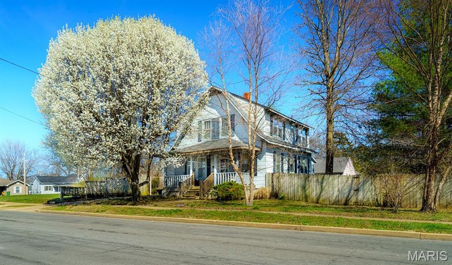 This is such a neat home with so much charm!  Welcome to the front porch for sitting and enjoying tea with a friend.  Cozy living room just off of the foyer, big open kitchen/dining and sitting area with lots of light and room for entertaining, large laundry room just off the kitchen with access to the privacy fenced back yard, spacious deck and detached garage.  There are 5 bedrooms total, one on the main level that could be your office/den, the others are upstairs.  The partial basement has lots of natural light and is a bright, usable space for all kinds of possibilities.  One of the few older homes in Rolla that has been loved and it shows!