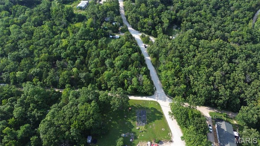 Corner Lot! Right down from the lake! Wheel Estates Lake in Villa Ridge, MO is located near 1-44 offering rural-style living options, including this large lot, suitable for fishing or recreational use.