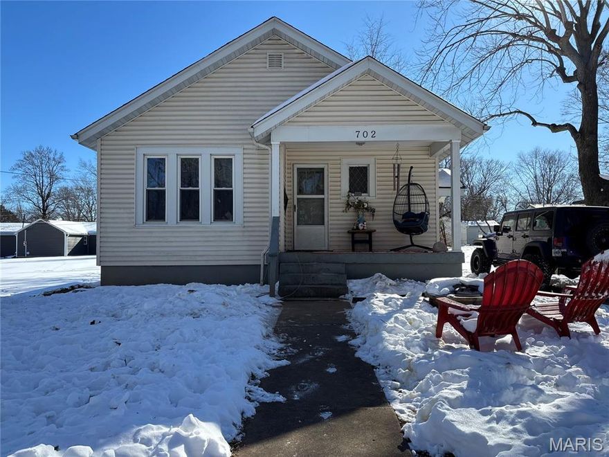 Check out this charming bungalow! Conveniently located and well maintained, ready to move in. Features include 2 Bedrooms 1 Bath, separate dining, full basement, detached garage with electric service, new privacy fencing, hardwood floors,and covered front porch! Would be perfect for a first time home buyer or anyone that wants to enjoy less maintenance.