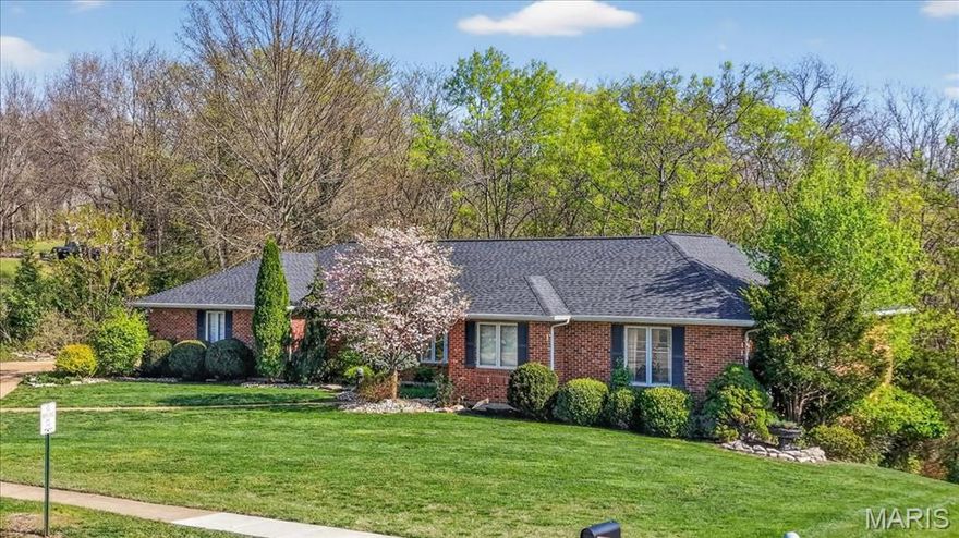 You won't want to miss this all brick, open floor plan ranch with approximately 3,500 square feet of living space situated on a stunning lot just under 3/4 of an acre. Inside, you’ll find five spacious bedrooms—each with its own walk-in closet—providing exceptional storage and flexibility. Gorgeous hardwood flooring flows throughout the great room, kitchen, dining room, sitting room, hallway, and primary suite, creating a warm and cohesive feel. The stylish navy and white kitchen is both functional and eye-catching, featuring stainless steel appliances, a coffee bar, and a center island with breakfast bar seating—perfect for gathering and everyday living. The adjacent great room offers an inviting space for relaxing or entertaining.  If you like entertaining you will love the additional space provided by the large dining room and sitting room. The generously sized primary suite includes a walk-in closet and a luxury bath with a separate soaking tub and shower. Two additional bedrooms, a second full bath, a large laundry room, and a convenient half bath complete the main level. The finished walk-out lower level expands your living space with two additional bedrooms (both with walk-in closets), a family room, game area, and a possible kitchenette setup—ideal for guests or multi-generational living. There’s also a massive storage area with potential for future finishing. And don’t miss the adorable bonus: a custom “bedroom” just for your dog! Additional features and updates include central vac system, covered patio, firepit area and the roof and HVAC were both replaced in 2025. Located within the highly sought-after Rockwood School District, this home also enjoys all the benefits of being within Fenton city limits, including less taxes, free weekly trash, recycling, and yard waste pickup, discounted access to the 71,000 sq ft RiverChase Recreation Center, and proximity to numerous parks and connected walking trails.