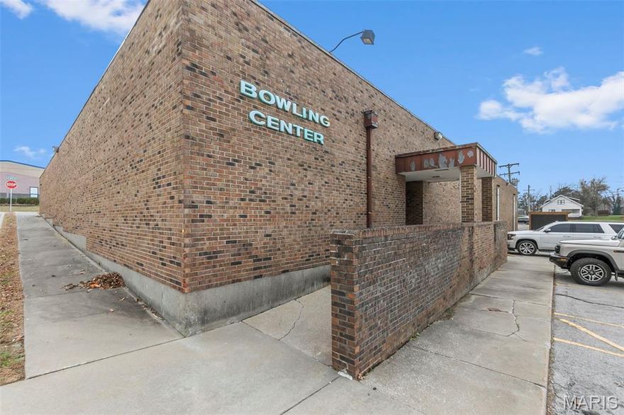 Opportunity to own a well known commercial property in the heart of downtown Perryville. This approximately 14,400 square foot building sits on a large lot and is currently tenant occupied by The Alley Cat Lanes and Lounge, providing an established presence and built in income potential. The property offers excellent visibility, ample space, and a prime location surrounded by local businesses, dining, and community activity. Ideal for investors or buyers seeking a sizeable commercial footprint with an existing tenant in place.