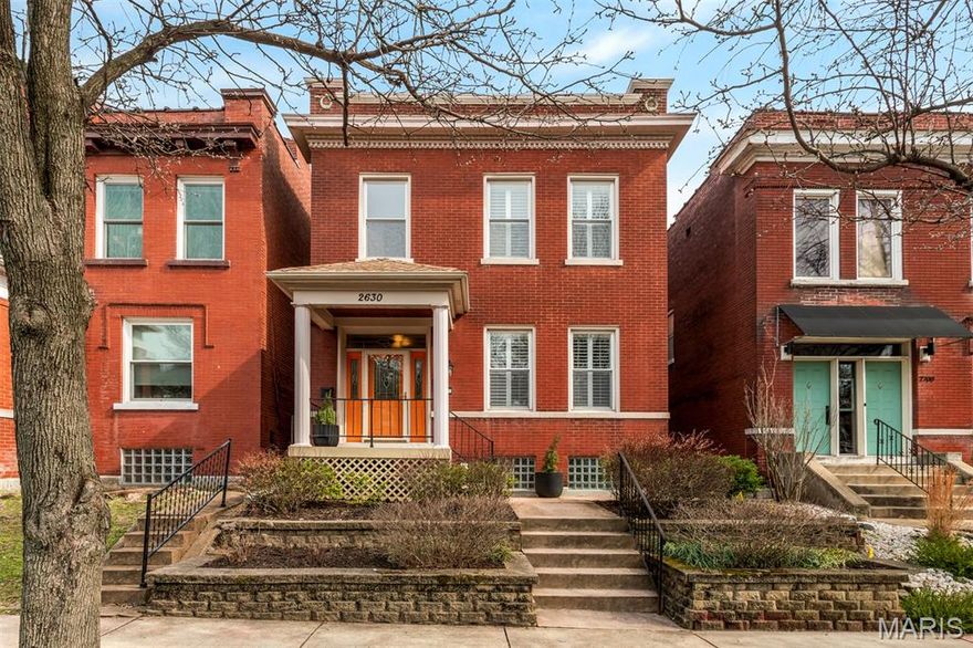 Discover a true historic gem in this lovely Tower Grove East 3+ bedroom, 2 bath home boasting original architectural details blended with careful updates in all the places they matter. Be charmed at first glance with the great curb appeal of the recently tuckpointed brick facade, established perennial beds and freshly rebuilt front porch. At the swing of the front door you'll be further taken by the original, turned wood stairwell, high ceilings and great natural light pouring through louvered shutters and updated windows. Step onto impeccably maintained dark oak floors, and admire the decorative fireplace standing proud in a comfortable living room framed in original woodwork and crown molding. Through fully functional antique pocket doors you'll find an elegant dining room hung with a statement chandelier which highlights a space intimate enough for dinner for two, or sufficiently gracious to host Friendsgiving. The kitchen was recently refreshed with solid surface countertops, a modern mosaic backsplash and stainless appliances, lending great aesthetic appeal to excellent culinary function and storage. Out back you'll find a wide, level lot with an inviting brick patio that's privately tucked inside the fully fenced yard, while a generous parking pad with room enough for visiting guests is tucked out back. A first floor full bath with comfortable glass shower enclosure doubles as a great powder room. Elegant form and modern-day function continue up the stairs in the generous front bedroom that opens through an arched entry to a bonus reading, play or office space. A rear, primary bedroom offers a great closet and privacy for a leisurely book and Saturday breakfast in bed. The third, smaller bedroom offers even more opportunity for sleeping or office. Outside find an upper deck that suggests a sunrise coffee overlooking some of the loveliest architecture in the city, and the second floor full bath includes a combined shower and tub for a good, hot soak. Even the location is ideal, as the front steps lead to an easy stroll right into Tower Grove Park and all the surrounding restaurants, shops and bars; but with a home this comfortable you'll find yourself in no rush to leave. Call your favorite city savvy agent today, and come see all that Arkansas Ave has to offer!