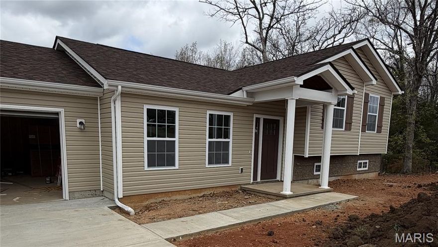 Coming Soon! Live the lake lifestyle in this brand new construction home in Terre Du Lac!  This 3 bedroom, 3 bath tri-level home offers approximately 1,200 sq ft of modern living with all new appliances (refrigerator included) a low maintenance deck overlooking the lovely back yard and wooded view, and a 2 car garage. The lower level is an additional 400 sq ft and open for your imagination in the spacious walk out to the lovely back yard for entertaining on those beautiful weather days.  Enjoy everything this private lake community has to offer - multiple lakes, golf, parks, playgrounds and dining- all just minutes from your front door.  Whether you are looking for a full time residence or a weekend getaway, this move in ready home checks all the boxes.  Come take a look and live the lake life!