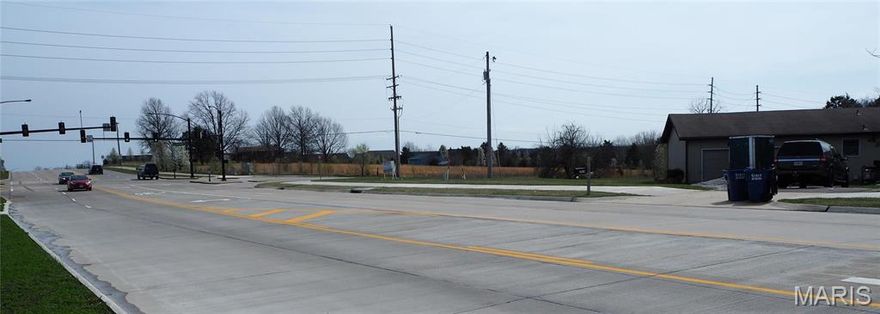 This 5.56+- acre landmark development opportunity is located on the SW corner of the signalized intersection of West Meyer Road and North Point Prairie Rd. Two parcels are combined for a total of 5.56 +/- acres and are to be sold together and closed simultaneously or the site can be subdivided. Property is to be voluntarily  annexed into the City of Wentzville, MO in order to access the City's water main along N. Point Prairie Rd, and the nearby sanitary sewer system. A favorable C-3 or other Zoning District in Wentzville could be obtained for your development.  The location of this property is experiencing explosive residential growth and is situated and poised in a definitive path for high traffic commercial development. Additional contiguous parcels of land are available for sale and can be purchased to suit the land size requirements for your development. With voluntary annexation into the City of Wentzville, your development's use may likely be a Permitted Use! See attached Permitted/Conditional Uses within the C-1, C-2, C-3, other Zoning. Also view the plans for the 2nd Phase of D.H.P. roadway extension!