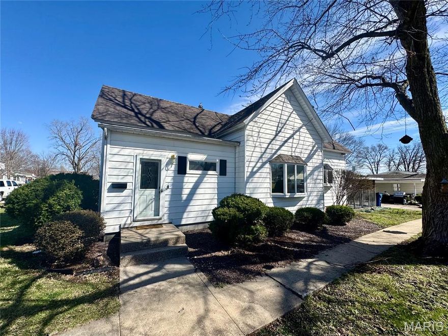 Welcome to 515 Madison Street in Canton, MO. A solid home that combines comfort and practicality. Step inside to a welcoming foyer and transition into a spacious living room with refinished hardwood floors that exude strength and character. With two living areas, you’ll have plenty of room to unwind or entertain. The kitchen is equipped with sturdy oak cabinets, a central island, and ample storage space for all your culinary endeavors. Enjoy the convenience of main-level laundry and two well-sized bedrooms, one featuring a walk-in closet. The addition, built in 2018, boasts a gas fireplace, bar, hardwood floors, and built-in display cabinets, ideal for gatherings or a quiet night in. Looking for a third bedroom? Customize the addition to fit your needs. Start your day with coffee in the screened-in porch or host friends on the patio. The detached two-car garage is perfect for parking or projects, while the flat yard offers space for play or gardening. Conveniently located, this home puts you in the heart of small-town living. Bonus- Prior to closing, the home roof will be replaced with shingles.