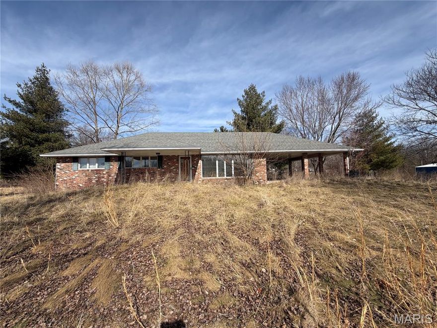 3 bed, 2 bath home on 3.31 acres in Rolla, located in the St. James School District. Features include an unfinished basement, large carport, and a 2-car detached garage/shop. Property is being sold as-is and the utilities will not be turned on at any time by the sellers. Sellers make no representations or warranties regarding property conditions. Potential environmental concerns, including mold, may exist. Buyers and agents should exercise caution during showings. Entry and showings are at the buyers and agents discretion.