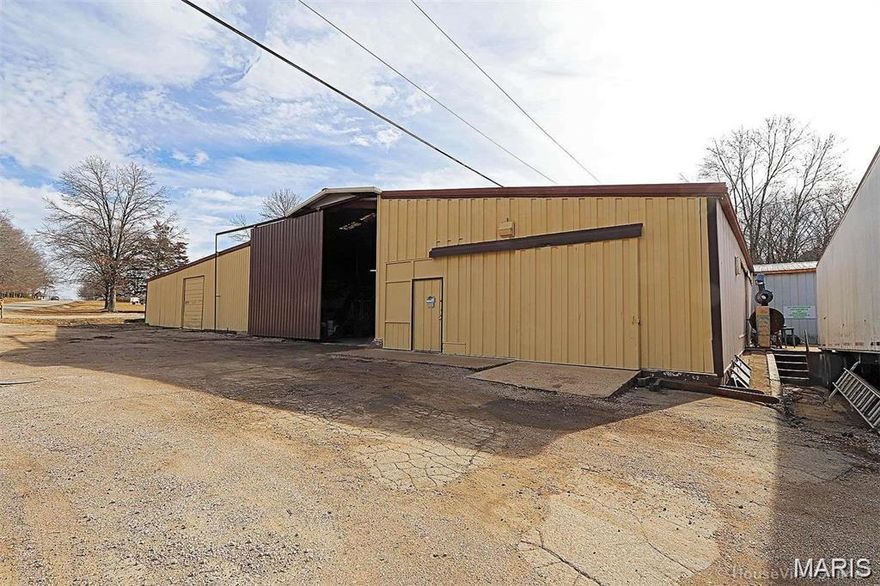 This commercial property offers a fantastic opportunity for investors or entrepreneurs looking to expand or start a business, with a large steel building, multiple loading docks, and generous office and living spaces. Its prime corner location in a high traffic area makes it ideal for manufacturing, warehousing, repair services, or storage facilities, especially for heavy equipment, RVs, or trailers. The property’s features, such as 3-phase electric, 400 amp service, and reinforced concrete floors, provide a solid foundation for various industrial or commercial uses, making it a versatile and potentially lucrative investment.