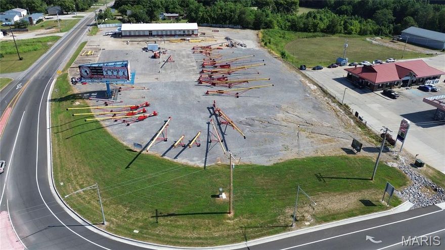 Prime investment and development opportunity near Gordonville in Cape Girardeau, MO.  Two tracts totaling 7.4 acres sit at the roundabout at the corner of Route K and State Highway 25.  A 5,130 SF metal building offers versatile potential for office, office/warehouse, retail, or day care use.  The corner frontage is fit for retail, fuel/c-store, or strip center development, and the lack of zoning provides flexibility for a wide range of business needs.  Additional included wooded acreage sits behind Acee's and would be suitable for residential development.  This property's strategic location offers access to high traffic and a thriving commercial corridor between Jackson and Cape Girardeau with a commanding visible corner fit for mixed uses.  Don't miss out on the chance to secure this unique property!