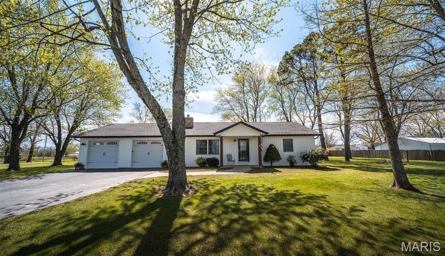 Welcome to your dream farmhouse retreat—where charm, functionality, and modern updates come together on 1.37 acres of beautiful, flat, and fully usable land! This stunning 3-bedroom, 2-bathroom home immediately captures attention with its brand-new board and batten siding and new roof, offering timeless curb appeal and peace of mind for years to come. Perfectly positioned with convenient access from Highway 133 and an additional rear entrance from a city street, this property provides both accessibility and privacy. Step inside to a warm and inviting interior where comfort meets style. The spacious living area is anchored by a cozy gas fireplace, creating the perfect atmosphere for relaxing evenings or gathering. Enjoy the best of indoor-outdoor living with a large back deck—ideal for entertaining, grilling, or simply soaking in the peaceful surroundings. Mature shade trees frame the property, adding natural beauty and a sense of tranquility that’s hard to find. This property truly shines with its incredible outbuildings. A spacious two-car heated shop offers endless possibilities for projects, storage, or business use, while the additional smaller shop with a covered patio area provides the perfect space for hobbies, entertaining, or a private retreat. Whether you're looking for a homestead feel, room to grow, or space to work and play, this property delivers it all—combining rustic farmhouse charm with modern updates and versatile amenities. Don’t miss your opportunity to own this one-of-a-kind property!