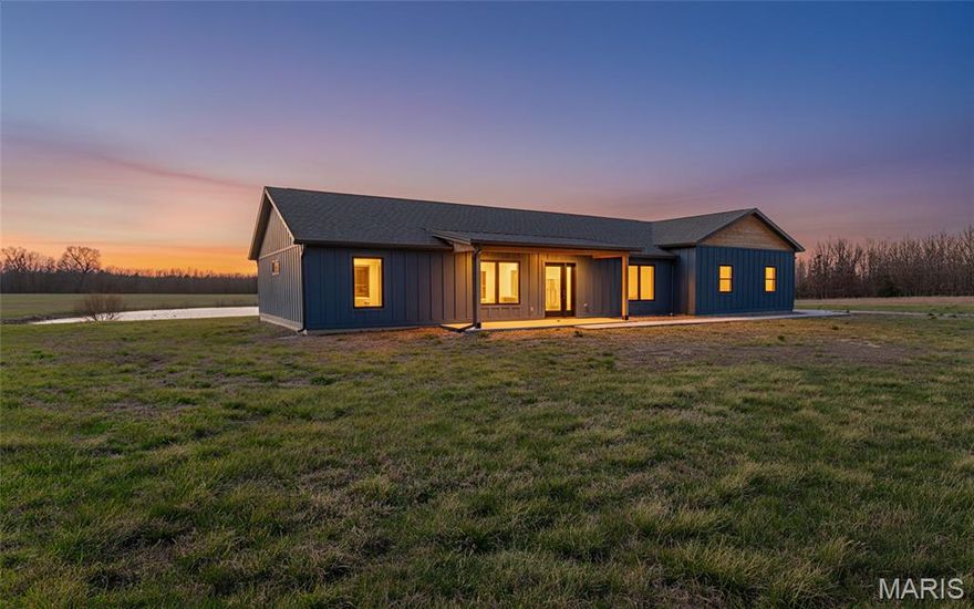 Don't miss seeing this distinctive main-level living home located at 4218 Oak Hill RD, Cuba, Missouri! This newly constructed, stand-out property embodies the promise of modern living in a country setting. Just built in 2025, this attractive home features an open floor plan, luxury casement windows and solid interior doors. Overlooking the neighboring one acre stocked pond, the stunning kitchen includes some stainless steel appliances, hickory cabinets and tons of storage including large butcher block island and a full pantry. The ADA friendly master suite includes 36” doors and a full walk in shower. The home’s quality exterior boasts band and batten siding, cedar and standing seam accents and an attached back deck. But best of all, the oversized (24-36-9) three-car, attached garage, has plenty of space for your car, your truck and your toys. Enjoy three acres in the peaceful Sunset Ridge neighborhood. There is a livestock restriction, but hens are allowed. You’ll be just minutes from town or from some of Missouri’s best hunting, fishing and floating destinations. Additional three acre adjoining lot with one acre pond also available - contact agent for more info, to include pricing and survey of additional lots. Call for your private showing today!