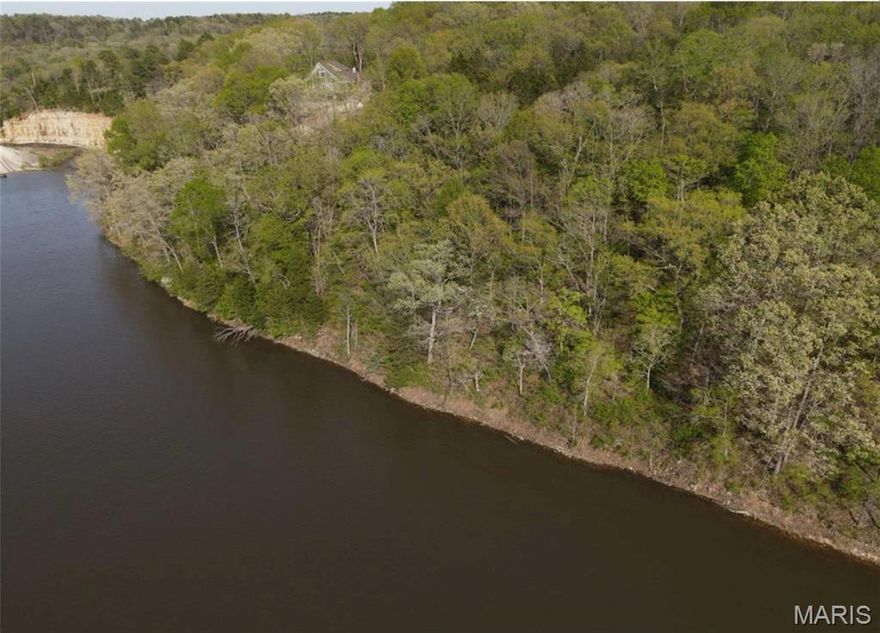 Your Private Lakefront Escape Awaits in Grayhawk! Tucked away in the serene and sought-after Grayhawk community of Ste. Genevieve, this 5.15-acre lakefront lot offers a rare opportunity to build your dream home or weekend getaway in a peaceful, natural setting. With gorgeous wooded surroundings, this property provides ultimate privacy, while also boasting incredible views of the water. Whether you're looking to enjoy quiet mornings with coffee by the lake, explore the woods, or simply relax in the beauty of nature, this lot checks all the boxes. With plenty of space to spread out and endless potential for outdoor living, you can create your own private retreat just the way you imagine it. Grayhawk is a gated community known for its lakes, trails, and laid-back lifestyle—just over an hour from St. Louis, but a world away from the hustle.