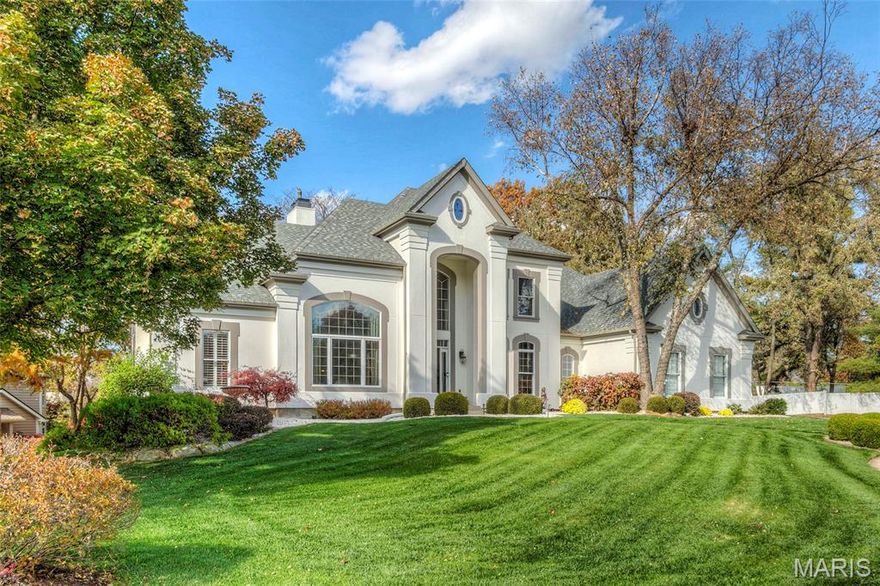 Stately 1.5-story home in the desirable Sea Beauty Farm Estate on a corner cul-de-sac lot with nearly 4,000 sq ft above grade plus a stunning finished lower level. The 2-story great room features a stone fireplace & wall of windows showcasing a private, park-like yard. Remodeled gourmet kitchen with quartz counters, slate floors, stainless appliances, double ovens, gas cooktop, large pantry, & breakfast bar. Main-floor primary suite with coffered ceiling, bay window, custom spacious closet, & spa bath with jet tub, large shower, & dual vanities. Upper level offers 3 bedrooms with oversized closets, 2 updated baths, & a sitting nook. The beautiful lower level includes a family room with fireplace, wet bar, theater room (seating included), billiard room, fitness room, guest room/playroom, full bath, & ample storage. Exterior highlights: 3-car garage with epoxy floors, maintenance-free deck, huge patio with fireplace/grill, irrigation, new roof/gutters, new drive, fenced yard. Rockwood schools & prime location.