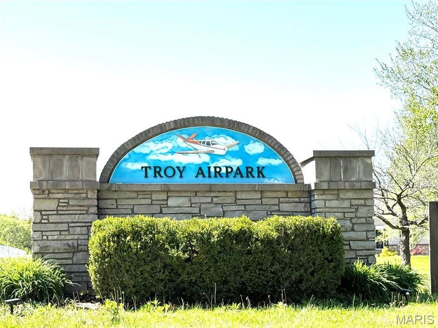 Build your dream home on this beautiful 3.32 acre lot in the desirable Troy Airpark neighborhood! Troy Airpark is a development that caters to pilots and plane enthusiasts. Subdivision has been thoughtfully designed with streets doubling as taxiways leading to it’s very own private airport.  The airpark has a 2100 ft. paved E/W runway with contiguous grass runway on the north side providing a smooth transition between the surfaces.  This lot will allow an in-grade basement with the front of the lot level or if you prefer a walk out lower level and/or more privacy, you can set the home further into the lot.  With over 3 acres, there are multiple locations suitable for a home site.  Subdivision has covenants and restrictions to protect your investment. Covenants & restrictions can be found at  https://troyairparkcommunity.com