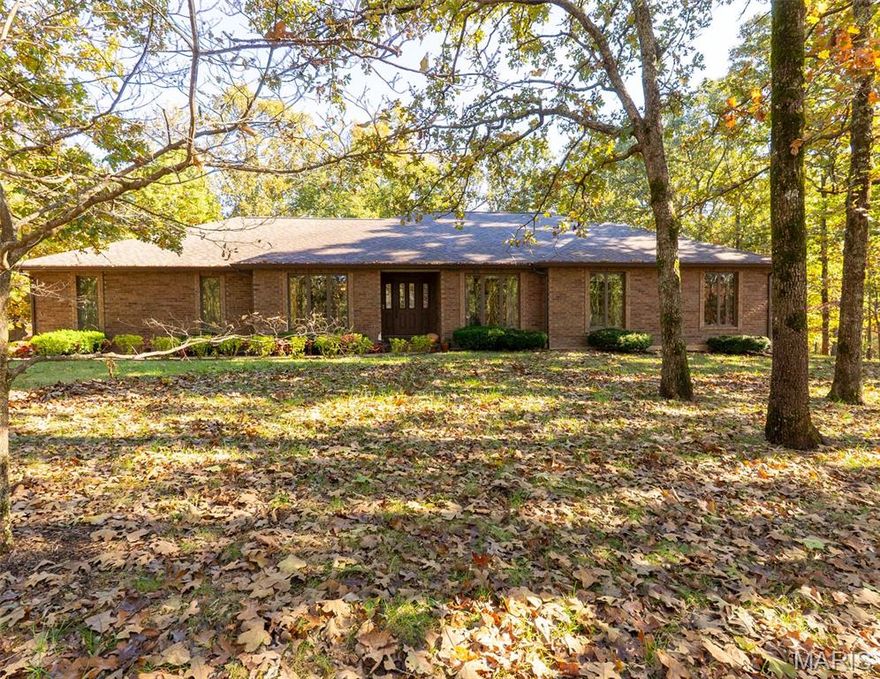 Refined Living Meets Nature’s Serenity: Your Private Forest Lakes Sanctuary

Experience the perfect harmony of sophistication and tranquility at 11915 Forest Lake Drive. This stunning, agent-owned, virtually maintenance free all-brick ranch featuring full length Andersen casement windows throughout is nestled on a sprawling 1.73-acre lot, offering an elite lifestyle across from Oak Meadow Country Club. From the moment you pull into the drive, you’ll feel the world fall away as you’re greeted by manicured landscapes and timeless curb appeal.

The Interior: Modern Elegance in Every Detail
Step inside to a bright, open floor plan bathed in natural light. Every inch of this 3-bedroom, 2-bath home has been curated for quality, featuring:
A Chef’s Dream Kitchen: Solid wood cabinetry, sleek granite countertops, and a high-end stainless appliance suite—including a double oven and gas cooktop. 
The Master Retreat: Escape to a primary suite, boasting a custom walk-in tile shower, a separate deep soaking tub, and a double vanity.
Stylish Versatility: Whether you’re working from the dedicated home office or relaxing in the vaulted great room by the fireplace, the brand-new flooring throughout ensures a seamless, serene feel.

The Outdoors: Your Personal Oasis
The excitement continues outside where 1.73 acres of lush Missouri landscape become your private playground.
Entertainer’s Paradise: Host sunset dinners on the oversized deck or gather friends around the massive concrete patio—the ultimate spot for summer soirees and weekend play.
Limitless Potential: The walk-out lower level offers a partial basement perfect for a workshop/hobby room, home gym, storm shelter, or a temperature-controlled wine cellar.
Unbeatable Location: Enjoy the peace of country-style living with the convenience of being minutes from downtown Rolla and easy I-44 access.

Don't just buy a property—invest in a lifestyle that offers the quiet you crave and the luxury you deserve. Schedule your private tour today and fall in love with Forest Lake Drive!