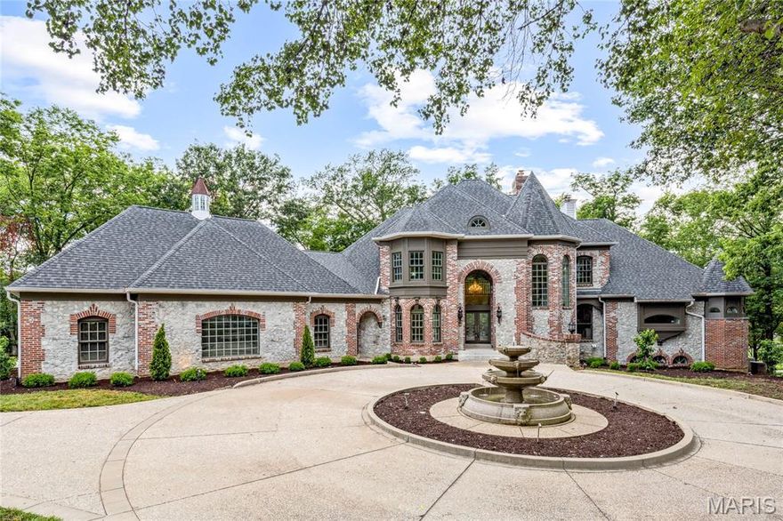 Crafted by renowned builder J.L. Wise and designed by William D. Cover, this extraordinary estate offers timeless architecture, masterful design, and serene golf course views—all nestled on 1.27 private, manicured acres on a prestigious private lane in Whitmoor Country Club. A striking brick and stone exterior with intricate rooflines creates unforgettable curb appeal, further elevated by a circle drive and a sculptural fountain by artist Bob Cassilly. Leaded glass doors open to 2-Sty marble foyer enhanced by Schonbek crystal chandeliers & dramatic floating staircase leads to elegant dining room & stunning great room with marble fireplace, wet bar & dramatic 2-sty bay window that offers perfect views of the 9th hole on the South course. Recently updated designer kitchen with 42” white cabinetry, exotic granite countertops, commercial grade appliances, 9’ center island & butler’s pantry adjoins light-filled breakfast room & vaulted hearth room with beamed ceiling & fireplace. Coffered primary bedroom suite features a see-through fireplace, beautifully appointed marble bath with shower spa & sitting room. The 2nd floor extends the living quarters with 2 additional ensuite bedrooms. Lower Level includes recreation room with stone fireplace & wet bar, media room, study with bespoke paneling, fitness studio & guest suite. Situated on a private lot with expansive driveway, 2 decks with newer decking, screen porch, patio, gazebo & oversized 4-car garage with storage loft.