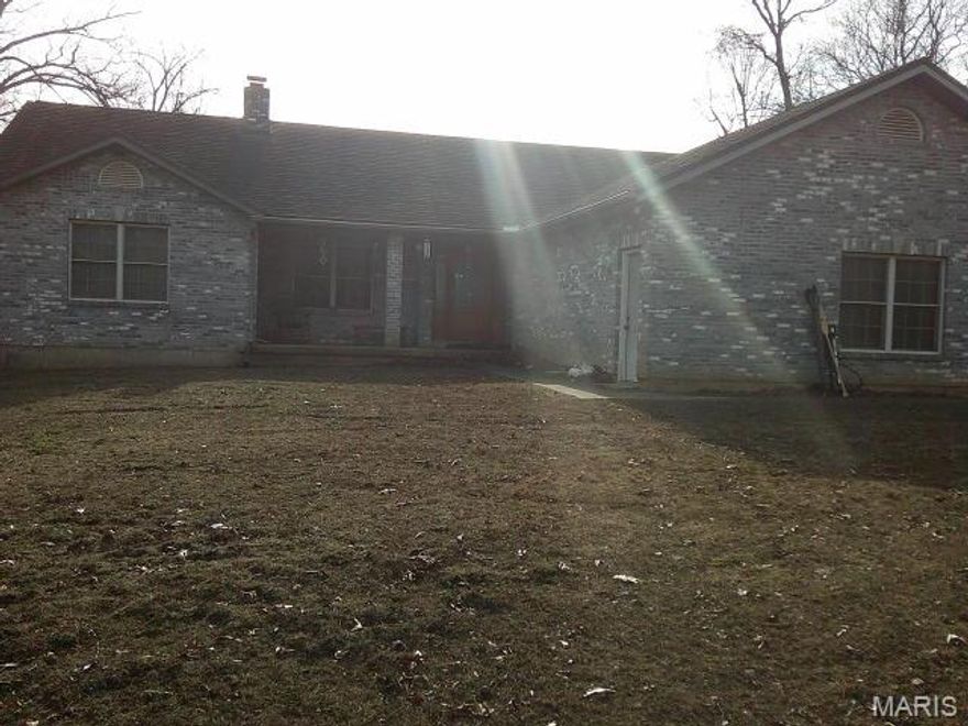 VIEWS with PRIVACY! 1968 sq. ft. all brick home on 34.6 Acres with attached 2 car garage. Master bedroom has a very large walk-in closet. Main floor laundry room with 1/2 bath. Large kitchen with breakfast bar & separate dining. Bedrooms 2 & 3 have a Jack n Jill full bath between. All brick floor to ceiling fireplace in living room. Large deck that spans entire length of home. Several spots to access deck including French doors in kitchen & master bedroom. The view from deck overlooks the surrounding valley. Great spot for morning coffee! Hardy outdoor wood furnace that can assist in heating (including supplementing hot water heater). 2 Parcels make up the 34.6 Acres (see arial). Children attend De Soto Schools. Even though one Parcel pays taxes to Washington County School District. If you're looking for a home in the country with lots of privacy, then this is worth viewing. Call with any questions or to set up your viewing. NOTE: Home has Erie Metal Roofing Shingles, Leaf Filter Gutter Guards were installed over the summer.