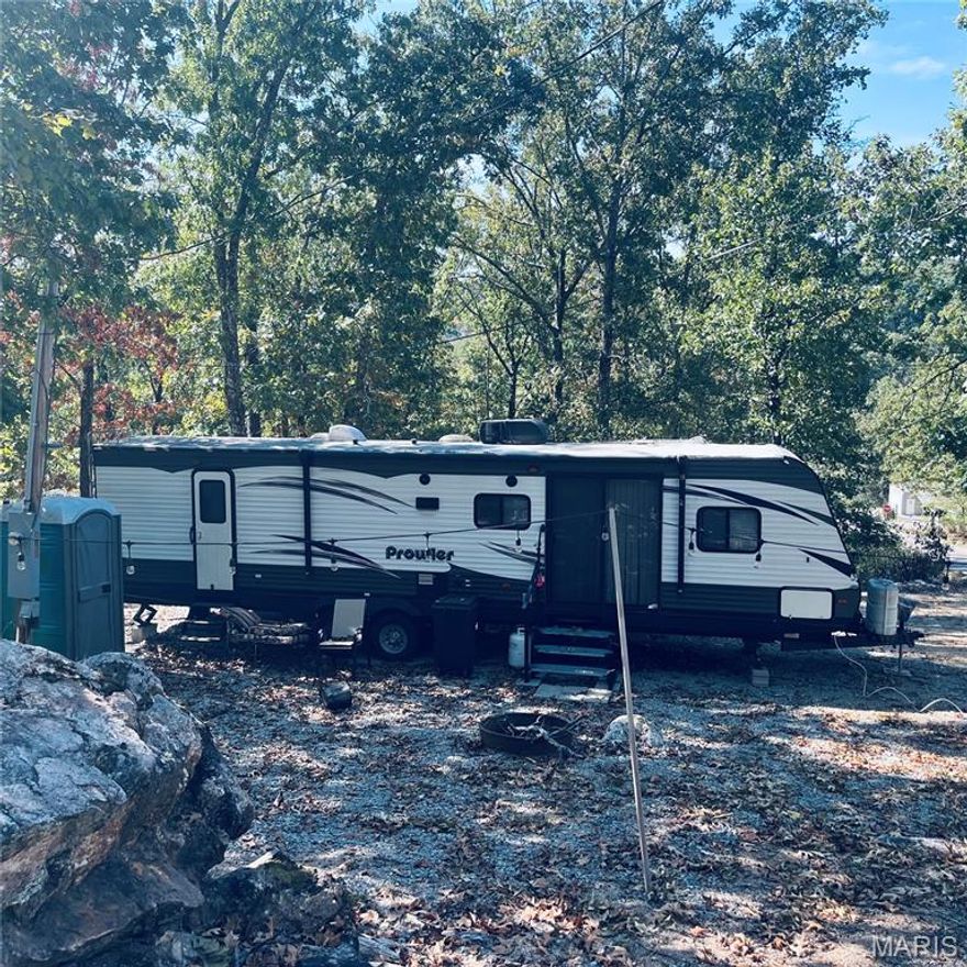 Ready for lake life? This turnkey recreational lot is waiting for you! Located in a gated lake community with a 400+ acre lake, pool, beach, and more. The lot is cleared, comes with a 50 amp hookup AND a beautiful 2017 37-ft camper with slide outs. Bring your boat, your floaties, and your friends – fun is included year-round with organized events, 24/7 security, and amenities galore!