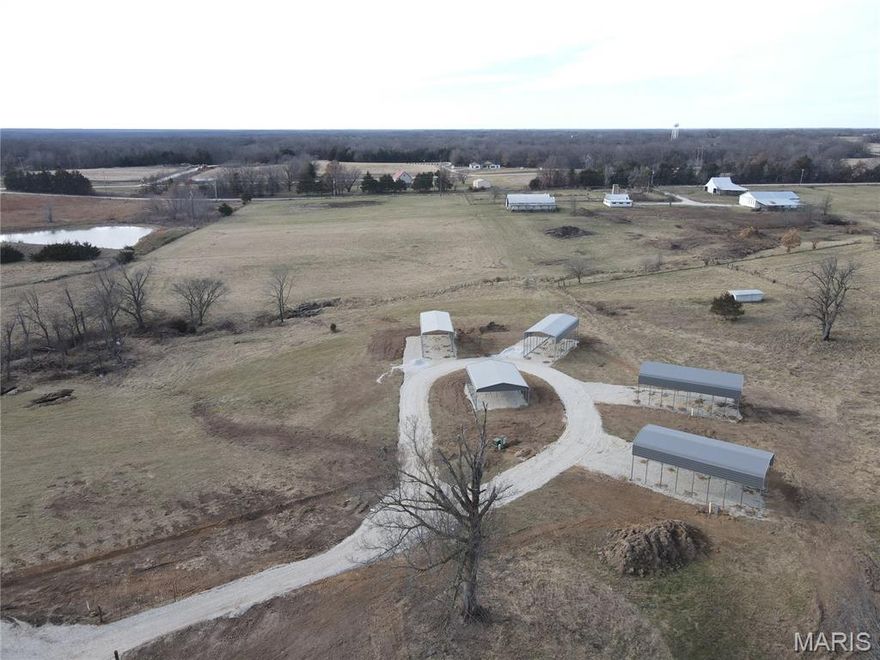 Discover 3 UNRESTRICTED/Gated acres perfectly set up for your Mark Twain Lake adventures. This versatile property features 4 RV pads, each equipped with full hookups including water, electric, fiber optics, and sewer, plus four 18' x 40' Legacy metal RV canopies and a 24' x 30' Legacy metal pavilion. Conveniently located just minutes from Jellystone Park, Water Zone, Spalding Recreation Area & Beach, Clarence Cannon Dam, Ray Behrens Recreation Area, Blackjack Marine, local restaurants, and more, this property offers endless possibilities. Come enjoy this private Monroe City, Ralls County, Missouri getaway, create your own RV retreat, or explore income-producing potential. Properties like this are rare—schedule your showing today and experience everything this sought-after area has to offer! See it! Love it! Own it!