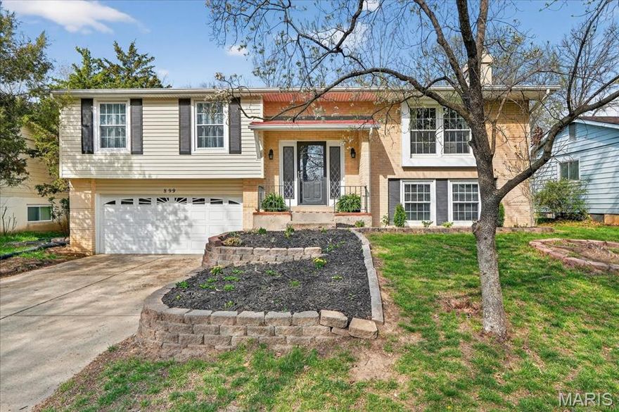 Cozy split foyer home situated on a large, level fenced lot backing to trees for added privacy. Enjoy the outdoor space from the spacious deck or the covered patio below, offering great options for relaxing or entertaining. Inside, the main level features durable luxury vinyl plank flooring throughout. The living room is warm and inviting with a wood-burning fireplace and a large double window that brings in plenty of natural light, flowing easily into the dining area. The kitchen is well-equipped with stainless steel appliances, a built-in microwave, a gas range, a pantry, and a breakfast area with direct access to the deck. The primary suite offers dual closets and a private full bath with a walk-in shower. Two additional bedrooms and a full bath complete the main level. The walk-out lower level adds valuable living space with a large family room featuring a second wood-burning fireplace, a rec room with a walk-through wet bar, and a convenient half bath. Additional features include a two-car garage, fresh paint throughout, and a new HVAC system to be installed prior to closing.