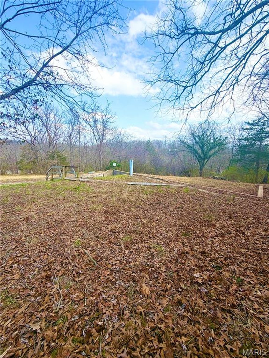 Nestled in a peaceful setting, this property offers a large lot with an existing concrete slab. The location blends privacy with convenience. Pump grinder on site hasn't been used in a few years. Utilities are accessible—Electric, public water, and public sewer. —Offering a smooth start to development. Whether you're looking to purchase a manufactured home or looking to build this property offers endless potential and the chance to own a desirable parcel. Don’t miss out on securing land in this developing area—Schedule a showing today and see the possibilities for yourself!