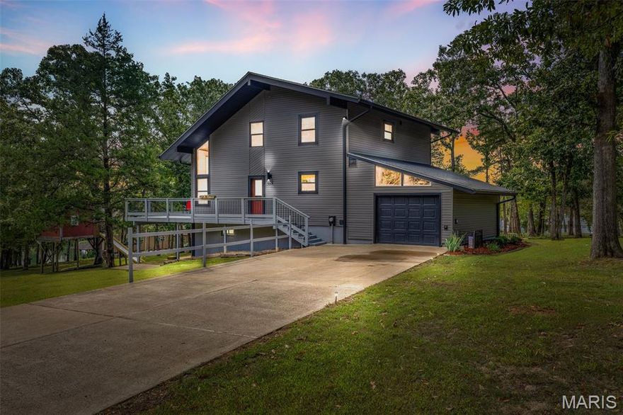 WATERFRONT HOME – Just 1 Hour from St. Louis!
Located in the highly sought-after Terre du Lac community, this beautifully maintained 1.5-story waterfront home offers the perfect retreat—whether you're looking for a primary residence or a weekend escape.

Enjoy all that Terre du Lac has to offer: 16 lakes (including 5 large lakes and 11 fishing lakes), a golf course, and a clubhouse—a true lake and leisure lifestyle!

Inside, this 3-bedroom, 2-bath home features a stunning floor-to-ceiling wall of windows in the two-story great room, flooding the space with natural light and offering unbeatable lake views. Gleaming hardwood floors run throughout the open-concept living and dining area, complete with a cozy fireplace.

The nicely appointed kitchen is both functional and stylish. On the main floor, you’ll find the primary bedroom and a full bath for convenience. Upstairs includes a loft-style balcony overlooking the great room, two additional bedrooms, and another full bath—plus breathtaking views of the water.

Need more space? The finished lower level includes a large recreation room and a built-in Murphy bed—perfect for overnight guests.

Outside is where the magic happens:

Private dock located in a deep cove, no-wake zone—perfect for swimming and paddleboarding.

Boardwalk from the home to the lake makes lake access a breeze.

Kids’ playhouse with its own zip line adds a touch of adventure!

This home isn’t just a property—it’s where lifelong memories are made.